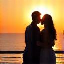 Couple enjoying sunset dinner on a yacht